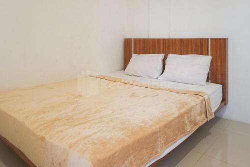 Кровать или кровати в номере Sakura Kos RedPartner