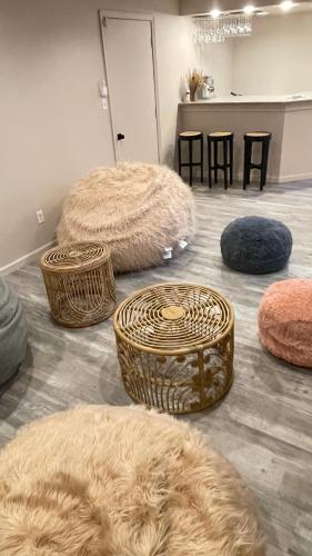 a room with several baskets and tables and chairs at Poconos Modern Chalet-Hot Tub-Home Theater-Lake in East Stroudsburg