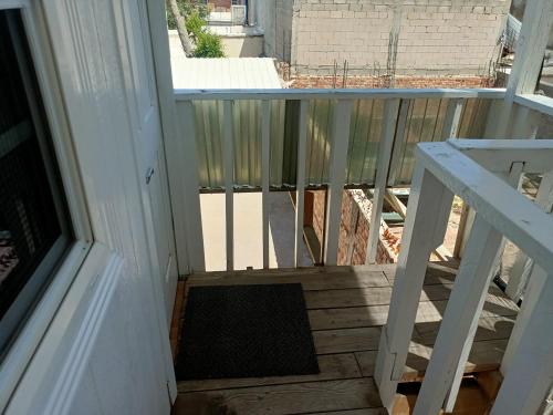 an empty porch with a railing and a door at Departamento independiente #3 in Ciudad Juárez