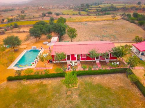 an aerial view of a house with a swimming pool at Wow Relish in Alwar