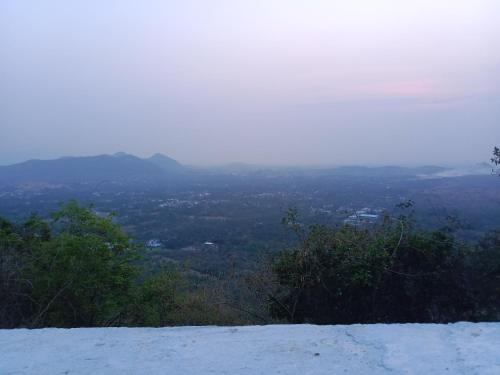 a view from the top of a snow covered mountain at RMS cottage in Yercaud