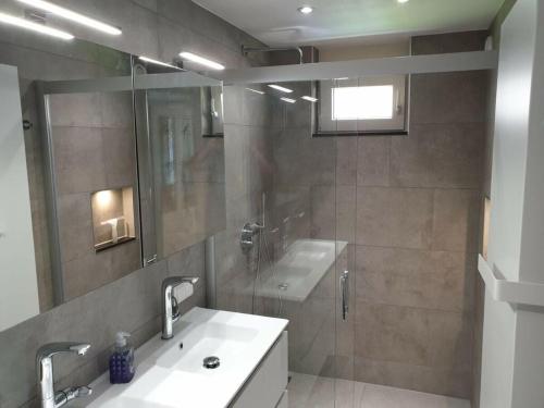 a bathroom with a sink and a shower at Vision Comfortable holiday residence in Sint Maarten