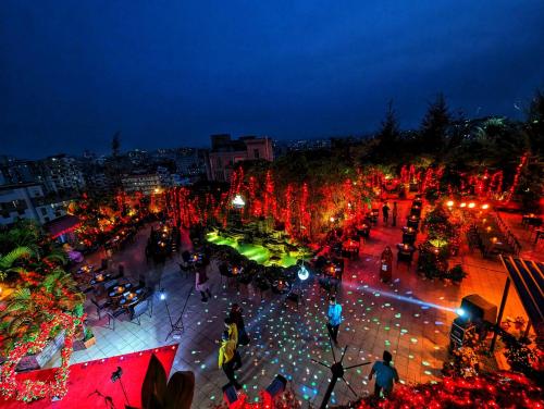 an overhead view of a city at night at Hotel Elite Palace in Comilla