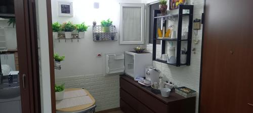 a bathroom with a sink and a toilet in a room at Awesomehouse centre Bari in Bari