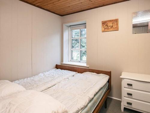 En eller flere senge i et værelse på Holiday home Millinge VII