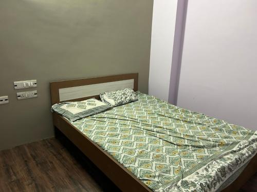 a bed in a bedroom with a bedspread with money at SANGAM PALACE in Bettiah