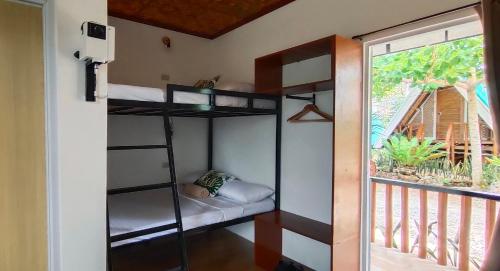 a room with two bunk beds and a window at RC Hutspot Tourist Inn in San Francisco