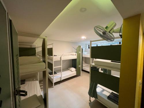 a room with several bunk beds in a room at Fuse Old Town Hoi An in Hoi An