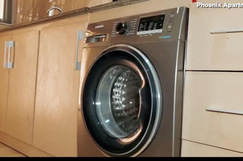 a washing machine is sitting in a kitchen at 3 bedrooms with Modern Amenities in Abeokuta