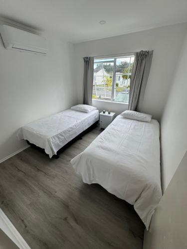Ein Bett oder Betten in einem Zimmer der Unterkunft Beach Bach Paihia