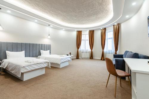 Кровать или кровати в номере AYKUN Hotel