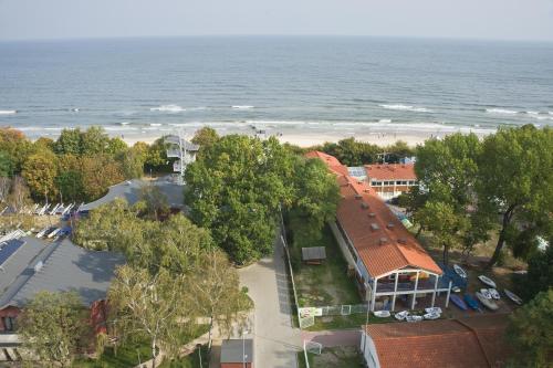 an overhead view of a building and a beach at Yacht Club Residence Sopot in Sopot