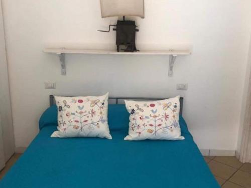 Ένα ή περισσότερα κρεβάτια σε δωμάτιο στο Apartment in Sardinia near Surf Paradise