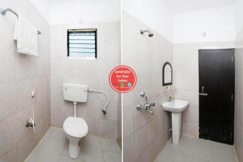 bagno con servizi igienici e lavandino di Hotel Sai Sandpiper Puri Near Sea Beach a Puri