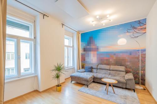 a living room with a couch and a table at M&O Apartment, Zentral in Innenstadt-& Bahnhofsnähe in Graz