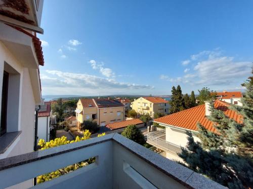 a view of a city from a balcony at Apartmani Romana in Punat