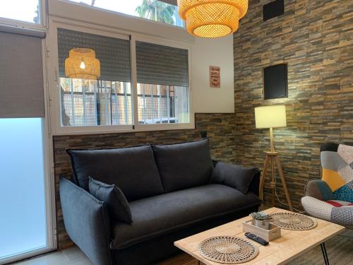 a living room with a couch and a table at Luna y Sol in Valencia