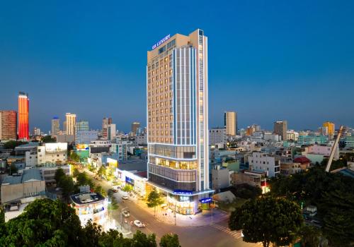 a rendering of a tall building in a city at G8 Luxury Hotel and Spa Da Nang in Da Nang
