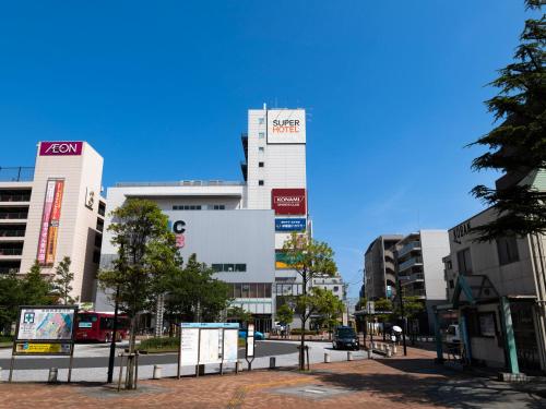 a street in a city with tall buildings at Super Hotel Tozai line Ichikawa Myoden Ekimae in Ichikawa