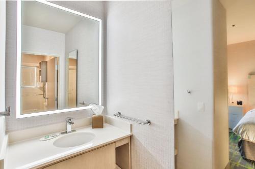 a bathroom with a sink and a mirror at SpringHill Suites Prescott in Prescott