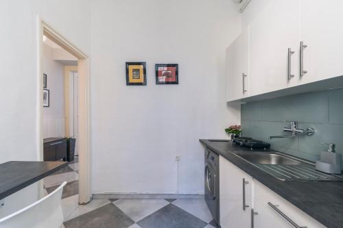 a kitchen with a sink and a counter top at Raday Bobo in Budapest