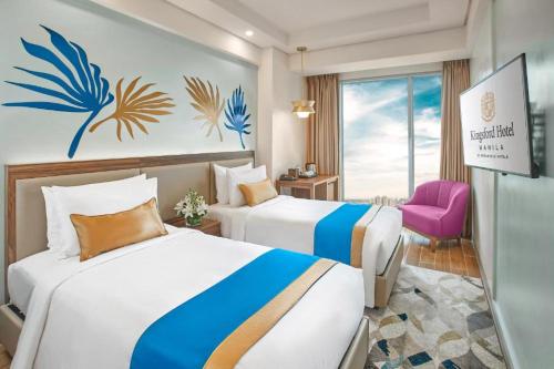 Säng eller sängar i ett rum på Kingsford Hotel Manila