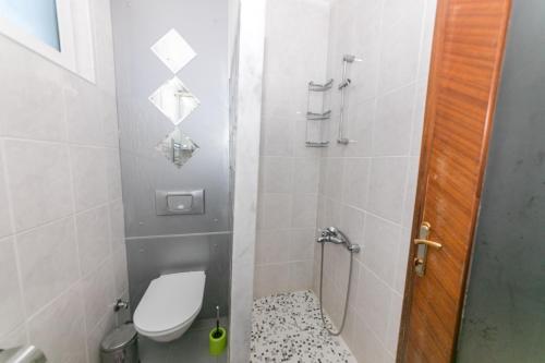 a small bathroom with a toilet and a shower at Villa MO DAİLY WEEKLY rentals İçmeler in Marmaris