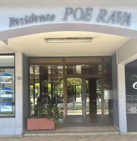 a building with the entrance to a restaurant post rail at Poerava Tahiti in Papeete