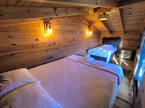 Кровать или кровати в номере Paşa Bungalov HOTEL