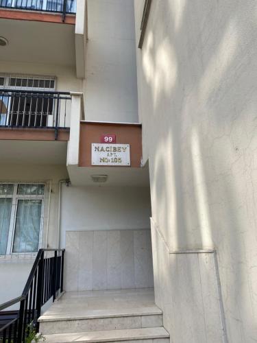 a building with a sign on the side of it at Kadıköy Kozyatağında Kiralık Daire in Istanbul