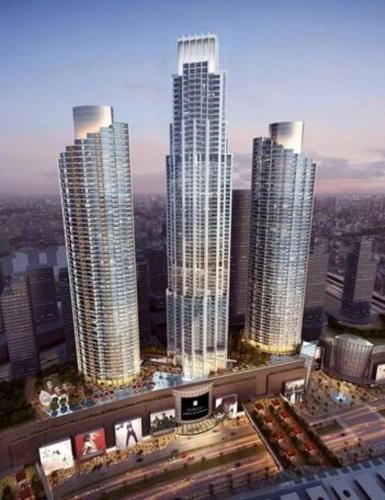 a group of tall buildings in a city at The Address Fountain Views - Residence 2 Bedroom with Burj Khalifa view in Dubai