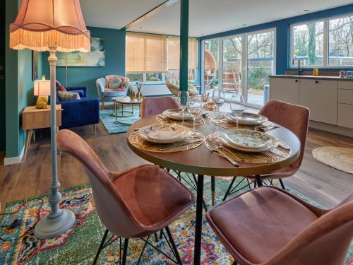 a dining room with a table and chairs at Lacuna VITA by Sonnevijver Residences in Lanaken