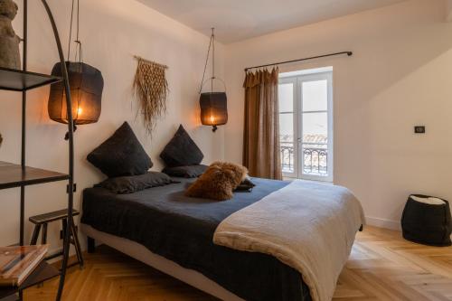 a bedroom with a bed and a window at Apt 4 * vue cathédrale Pey Berland in Bordeaux