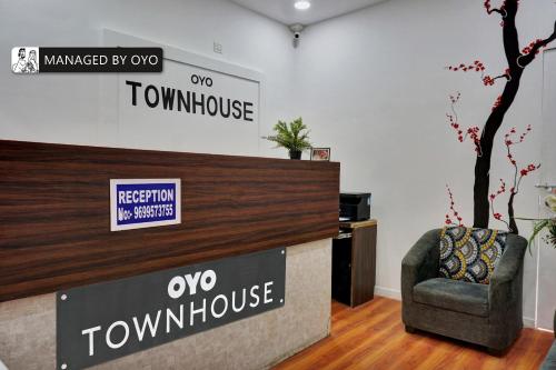 a reception desk with a chair in a room at Townhouse Imperial Inn Hinjewadi in Hinjewadi