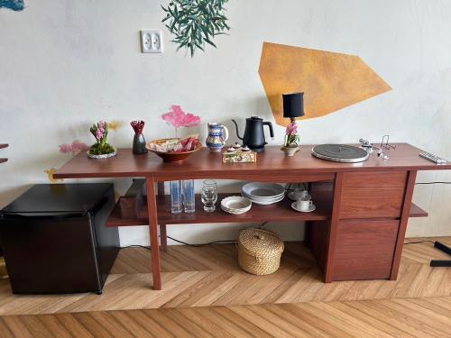 a wooden table with food on top of it at Hotel CASA VICO in Ako