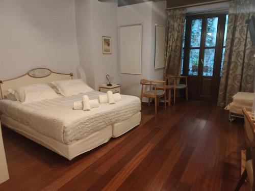 a bedroom with a bed with candles on it at Palazzo Duca in Chania Town