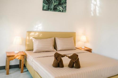 Säng eller sängar i ett rum på Chor Grande Resort