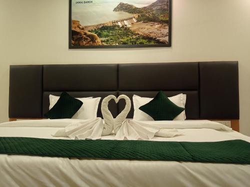a large bed with a heart decoration on it at Sun Stone Hotel & Club - Jawai in Sheoganj