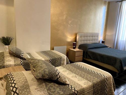 Säng eller sängar i ett rum på Hotel Citadelle