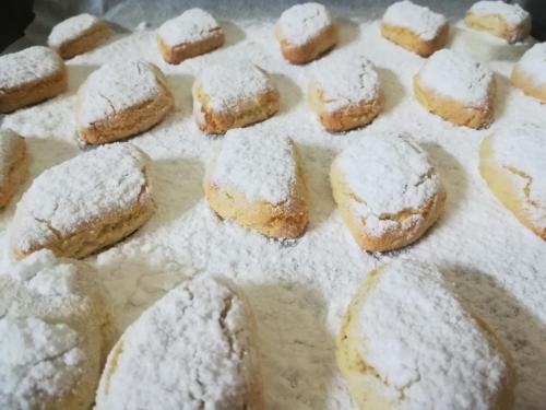 a bunch of pastries covered in powdered sugar at Masseria Le Terrazze di Serranova in Serranova