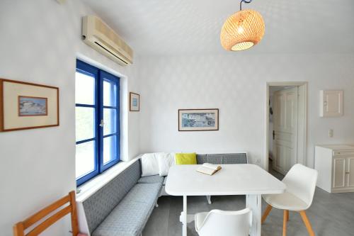 a living room with a couch and a table at Bexis Residences Hydra in Hydra
