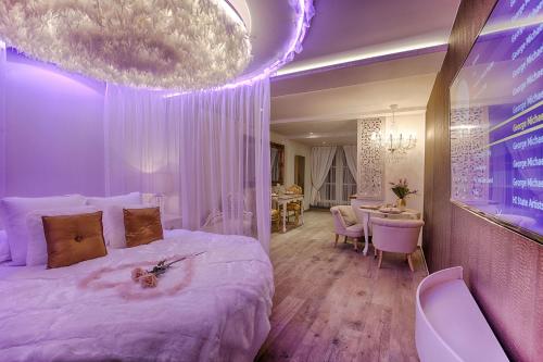 Giường trong phòng chung tại Le Clos des Thermes