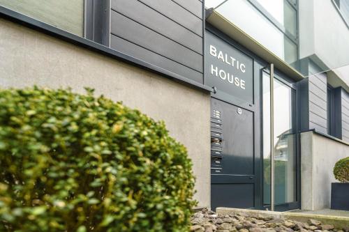 a building with a sign that reads banking house at Baltic House Sandburg in Timmendorfer Strand