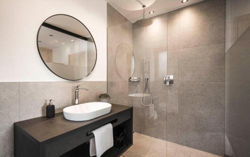 a bathroom with a sink and a mirror at Picea am Ötzerhof 2 in Merano