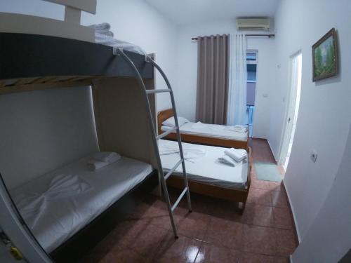 a bunk bed room with two bunk beds in it at Hostel Casa Mia SR in Sarandë