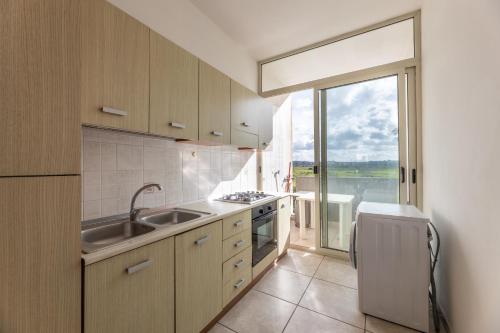 Nhà bếp/bếp nhỏ tại Appartamenti Rivabella Carpediem