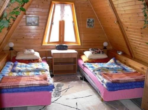 Postel nebo postele na pokoji v ubytování Ferienhaus für 5 Personen ca 85 qm in Barczewo, Masuren-Ermland Masurische Seenplatte