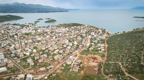 an aerial view of a city next to a body of water at Vila Limos in Ksamil