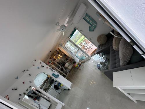 an overhead view of a kitchen and living room at FLAT Surrounded by Nature WIFI & Pool & beach Nearby in Son Parc