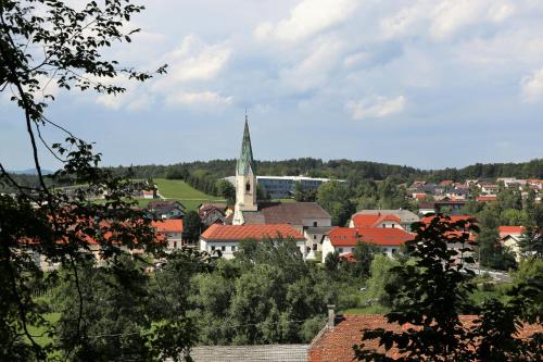 a town with a church in the middle of a city at Luxury Vineyard Retreat Matej - Happy Rentals in Trebnje